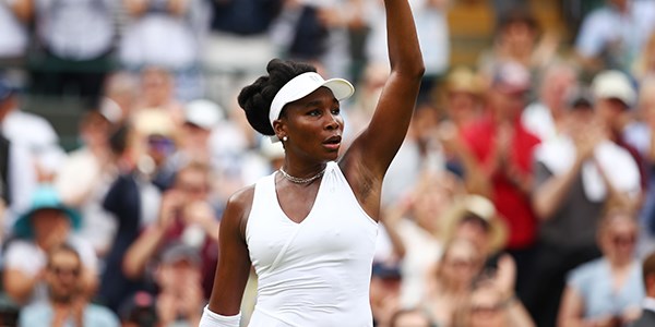LONDON, ENGLAND - JULY 04:  Venus Williams of The United States celebrates after defeating Alexandra Dulgheru of Romania during their Ladies' Singles second round match on day three of the Wimbledon Lawn Tennis Championships at All England Lawn Tennis and Croquet Club on July 4, 2018 in London, England.  (Photo by Clive Brunskill/Getty Images)